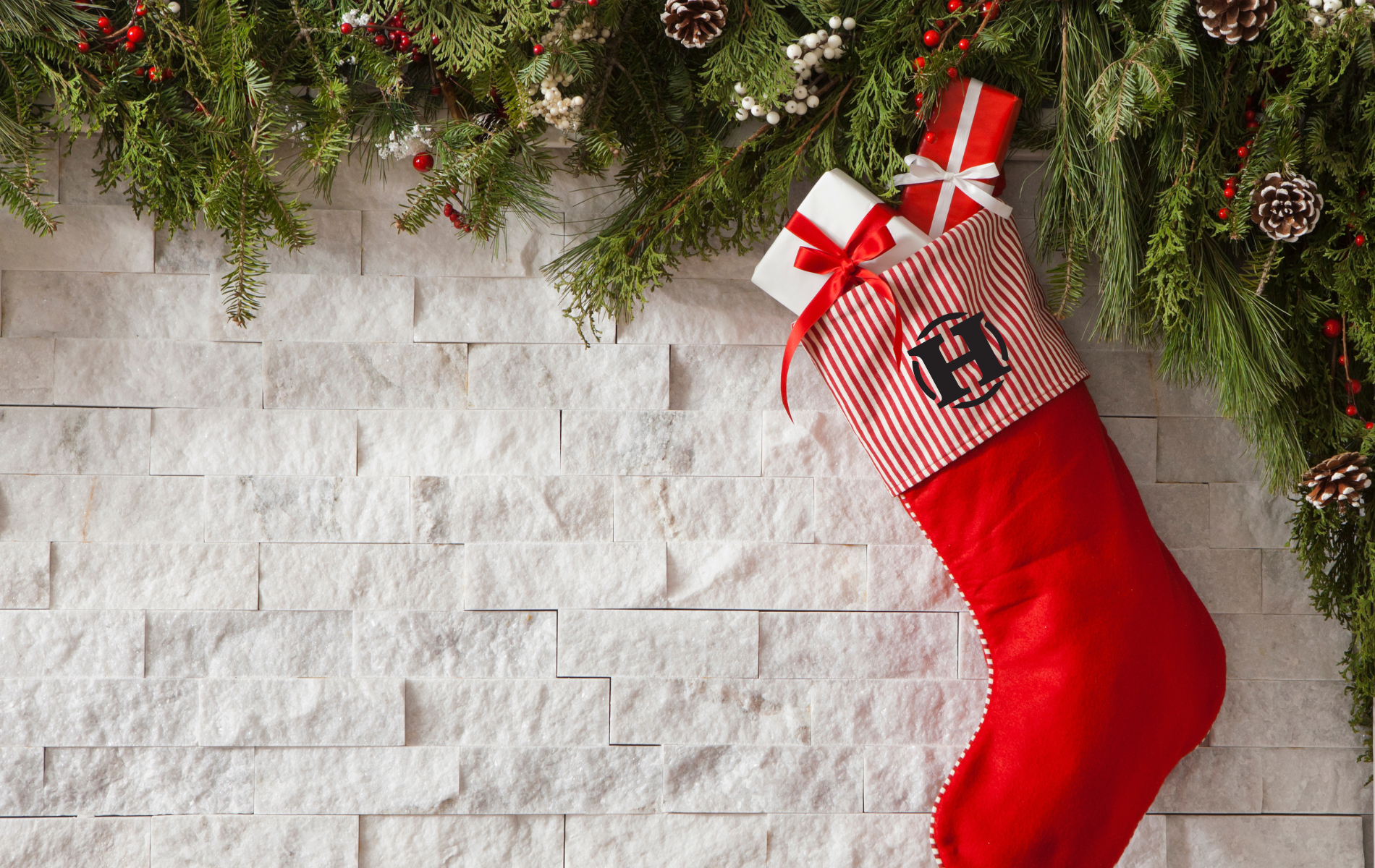 Red Stocking with white brick background and hanks logo on stocking