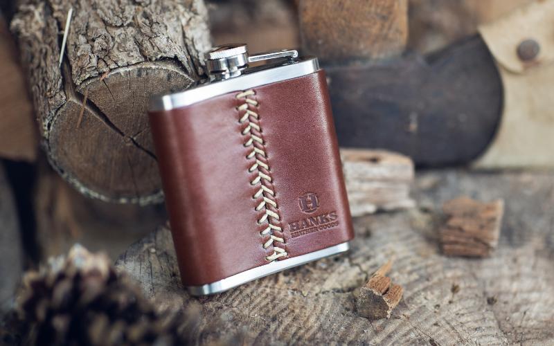 Flask on wooden background