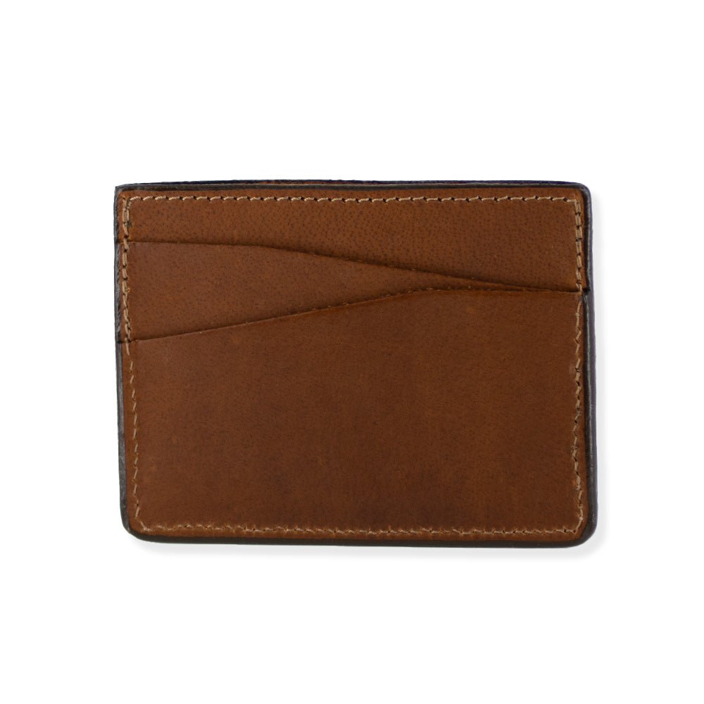 Introducing the Cumberland Bison Card Holder by Hanks Belts: a sleek, peanut brown leather wallet crafted in the USA. This sophisticated card holder features three card slots on one side and meticulous stitching along the edges, providing a polished look. Designed for minimalists, this ultra-thin and lightweight wallet offers a slim profile and exceptional durability, making it an ideal choice for everyday use.