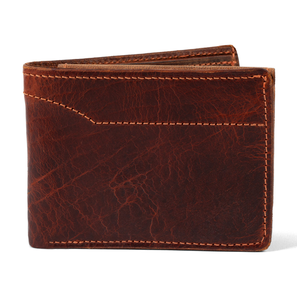 The Powell Bison Bifold with ID Window by Hanks Belts is a brown wallet made from bison leather, featuring visible stitching and a slightly worn texture. It combines vintage charm with durability and ample storage for style and function.