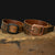 Hanks Relic Crazy Horse Belts sitting on wooden box