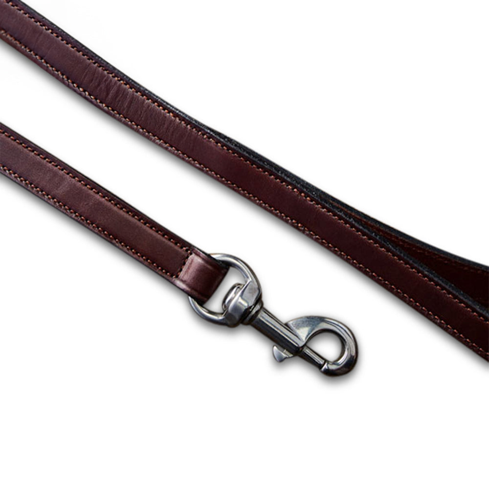 Close-up of the Old Reliable Leash by Hanks Belts, made from English Bridle leather with a metal clasp. The vegetable-tanned leather has polished edges and stitching, enhancing its sturdy look against a plain white background.