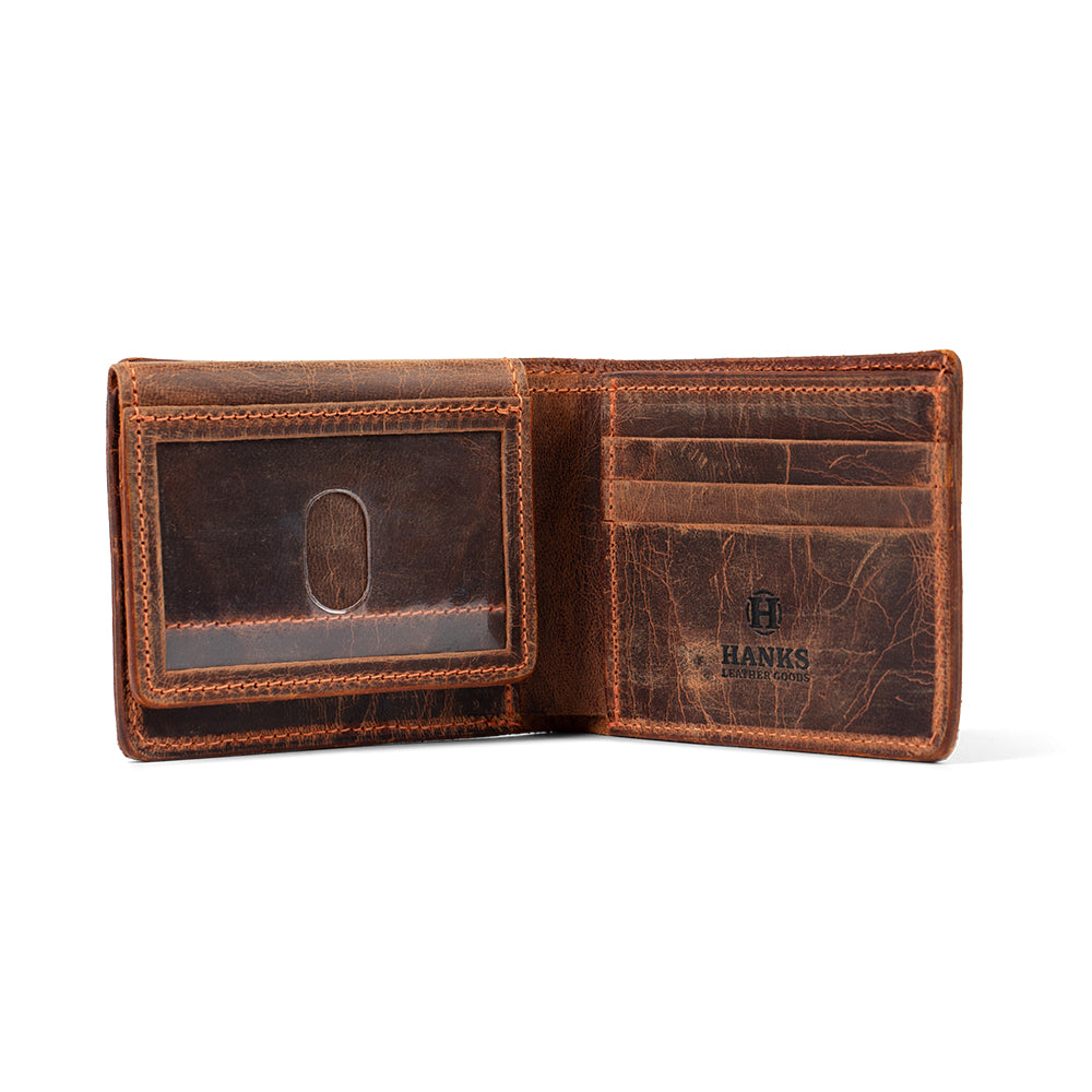 Open brown Powell Bison Bifold by Hanks Belts, featuring multiple card slots, a transparent ID window, and a textured finish. The logo &quot;Hanks&quot; is visible. Photographed against a plain white background for ample storage showcase.