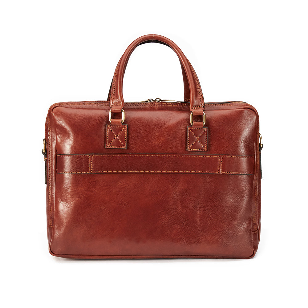 The Practical Laptop Bag by Hanks Belts is a luxury Italian accessory, expertly crafted from premium Italian leather. It features handles and a detachable shoulder strap, complemented by a front pocket and brass hardware accents for a blend of functionality with classic elegance.