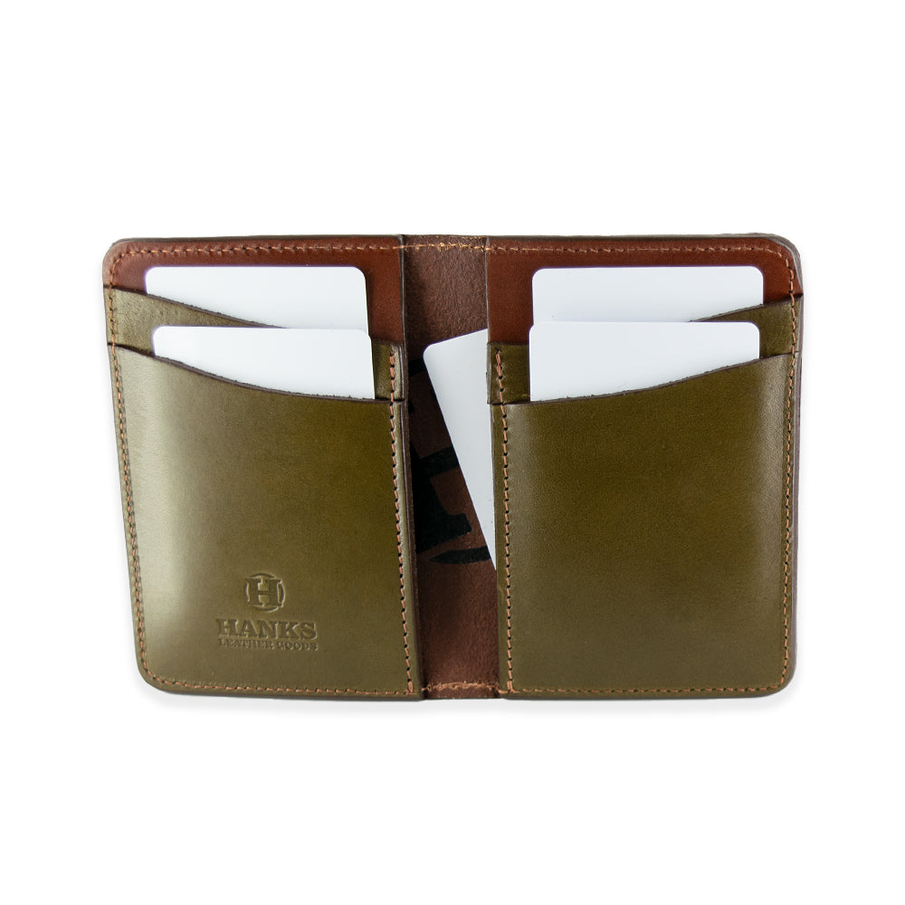 The Superior Front Pocket Bifold by Hanks Belts is handcrafted in the USA using premium English bridle leather in an open brown and olive-green design. It has six card slots, each holding a white card, with an inside flap embossed with the &quot;HAWKS&quot; logo for expert craftsmanship and style.