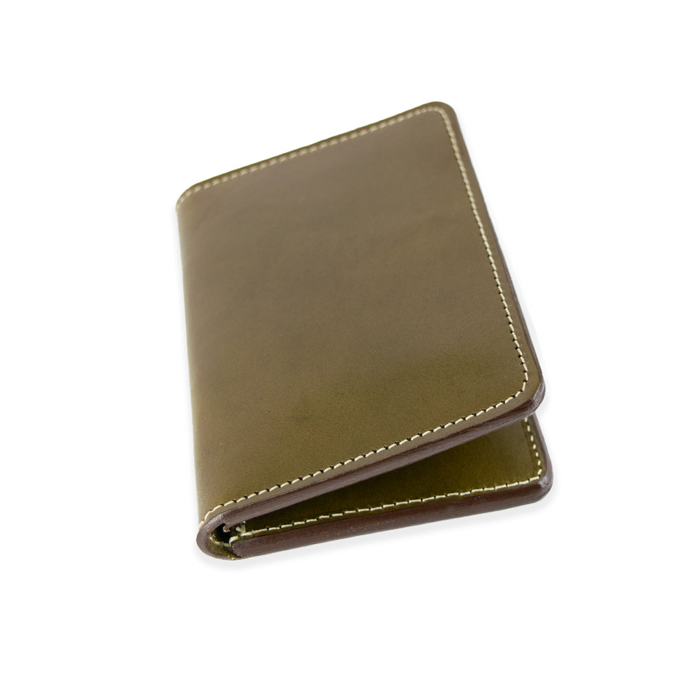 The Superior Front Pocket Bifold by Hanks Belts is a handcrafted premium leather wallet with white stitching, elegantly folded on a white background.