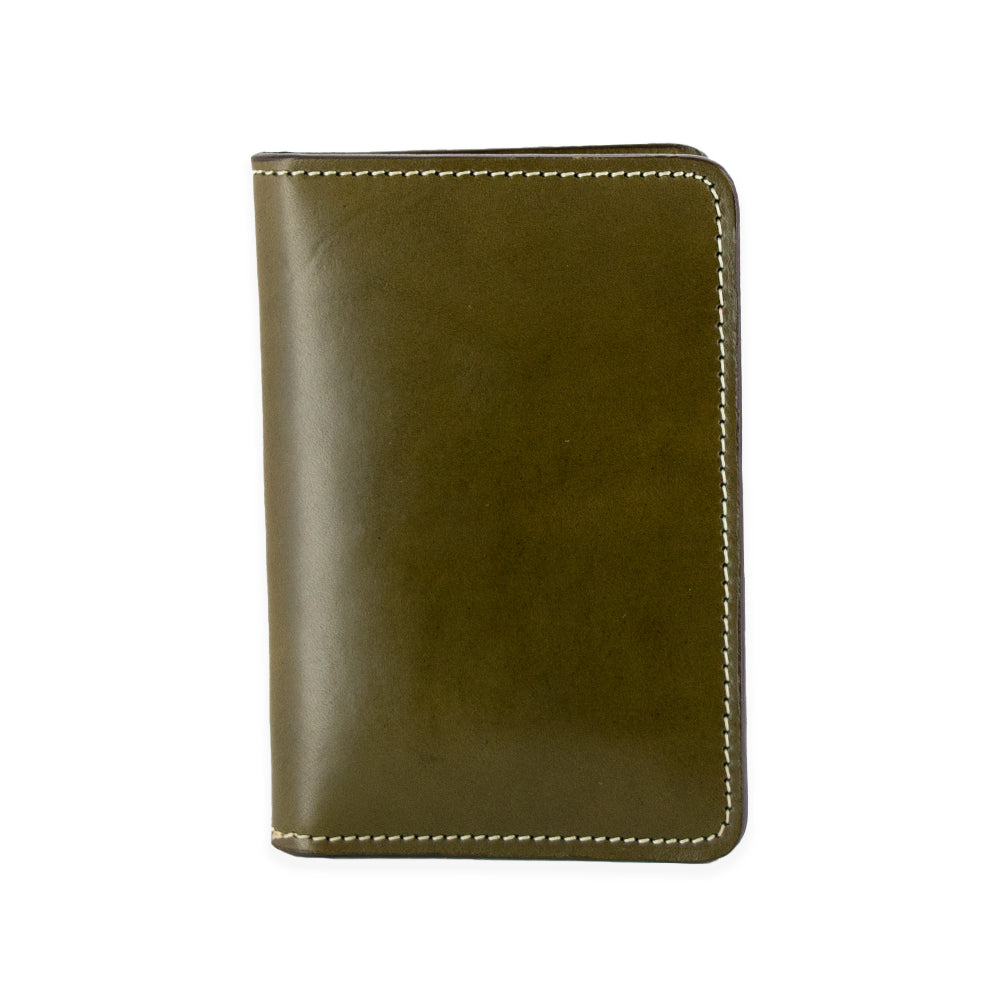 The Hanks Belts Superior Front Pocket Bifold is a vertically positioned closed olive leather wallet, handcrafted from USA Tanned English Bridle Leather with visible white stitching against a white background, showcasing its premium quality.