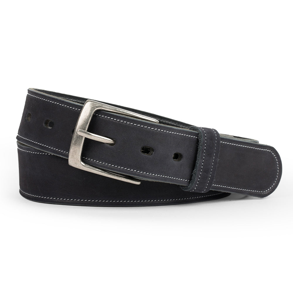 The Suede Belt - 1.5&quot; by Hanks Belts is a black nubuck leather belt featuring white stitching and a silver buckle, made in the USA. The belt is rolled and placed against a white background.