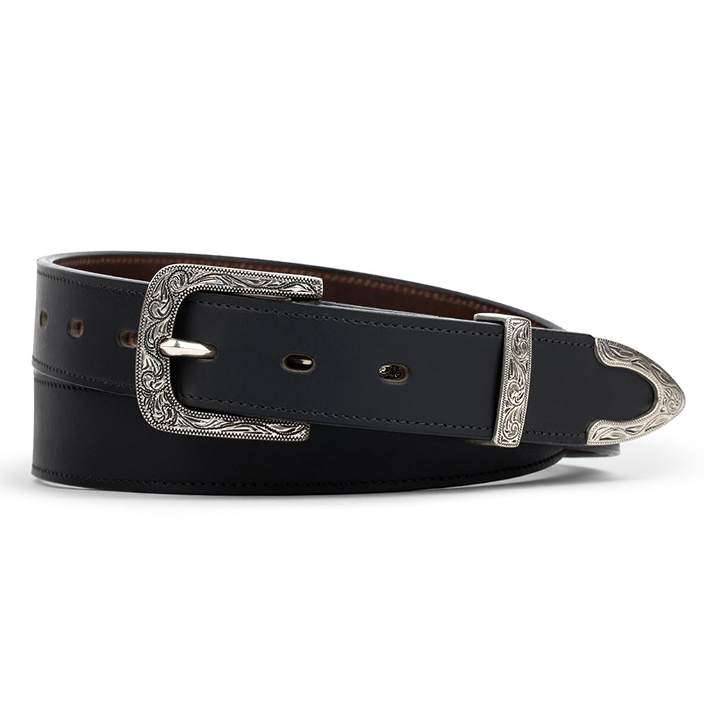 The Dakota Belt by Hanks Belts is a 1.25&quot; black bison leather belt featuring an ornate floral silver buckle and detailed silver tip, coiled neatly to show its adjustable multiple holes.