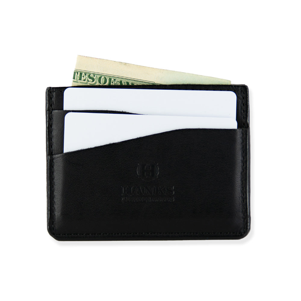 A black bison leather cardholder wallet featuring the &quot;Hanks Leather Goods&quot; brand logo on the front. Made in the USA, this Cumberland Bison Card Holder contains a few white cards and U.S. dollar bills partially visible in the top compartments. Featuring durable bison leather, it is simple and compact in design.